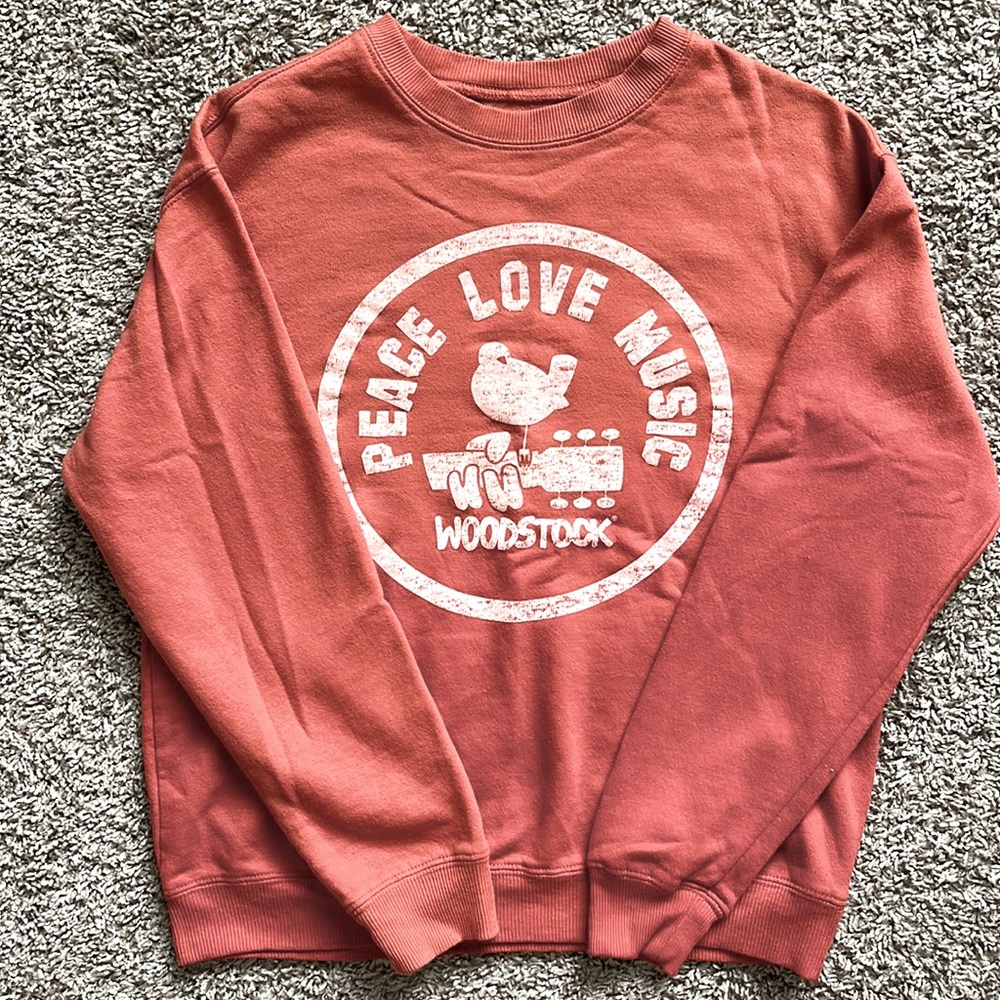 Never worn. Orange Woodstock crew sweatshirt